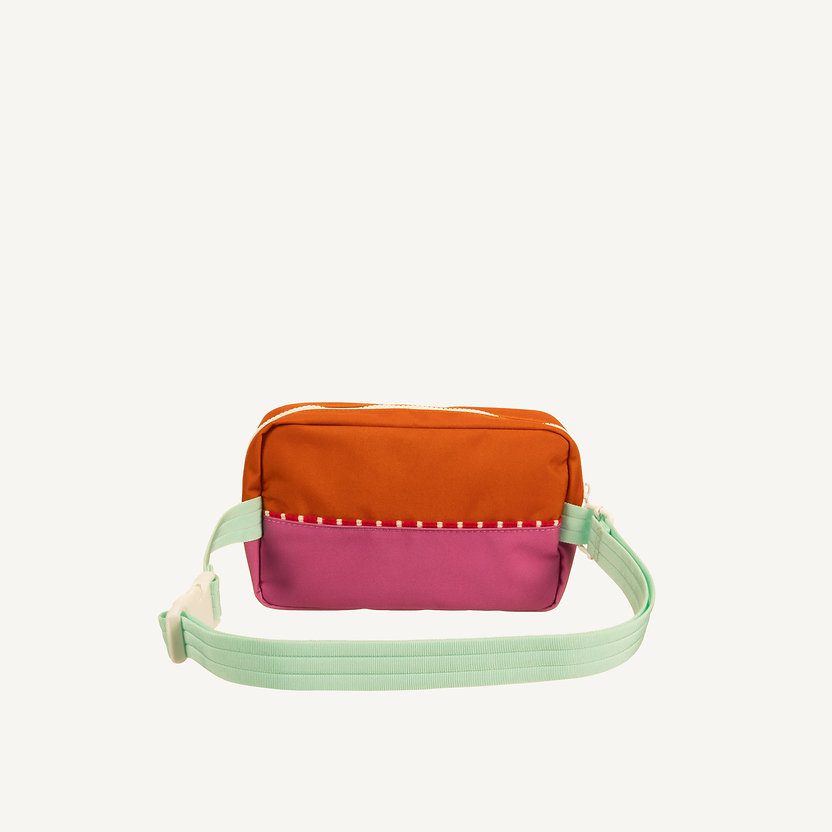 sticky lemon fanny pack in de kleuren oranje en roze met mintgroene band