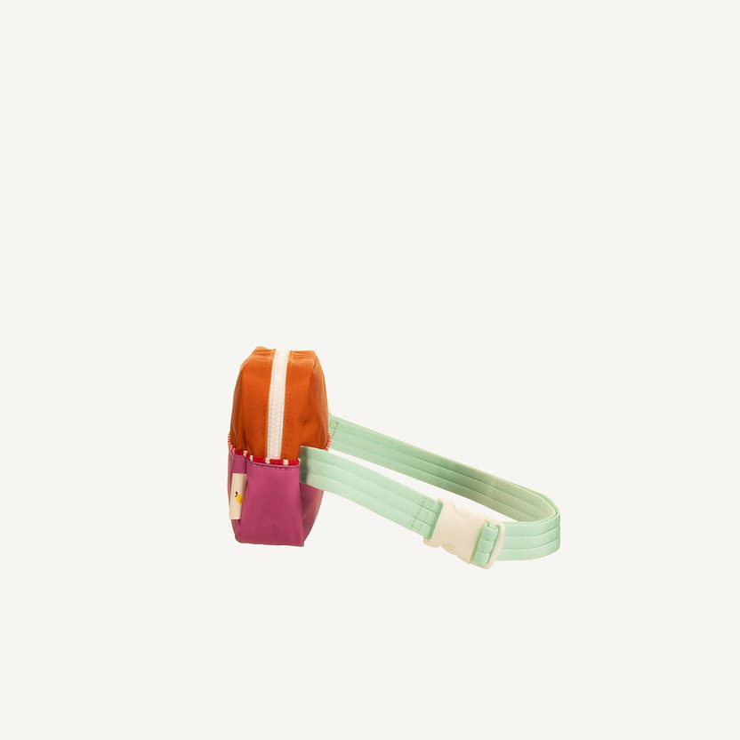 sticky lemon fanny pack in de kleuren oranje en roze met mintgroene band